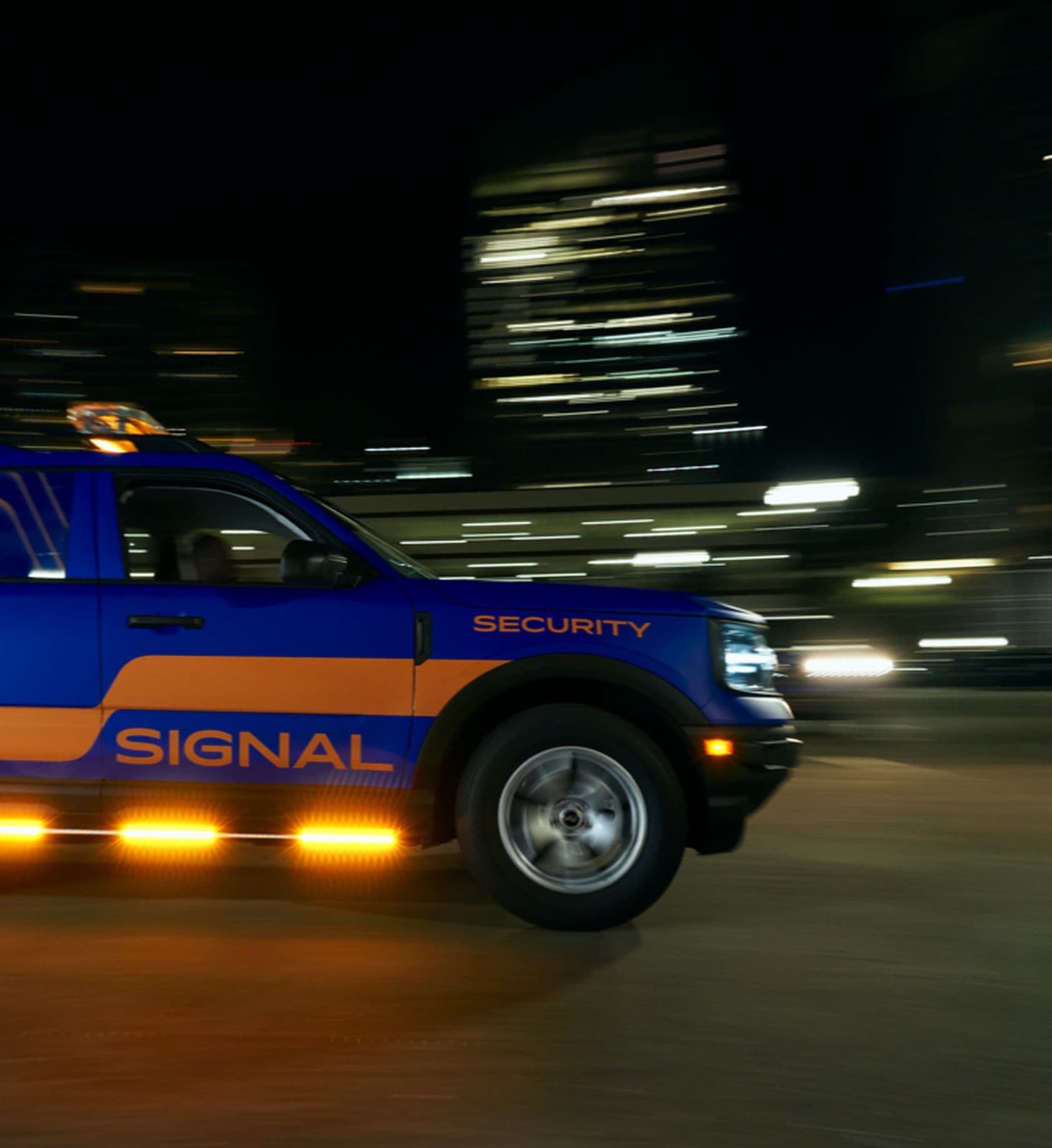 Signal apartment security patrol car driving down the street