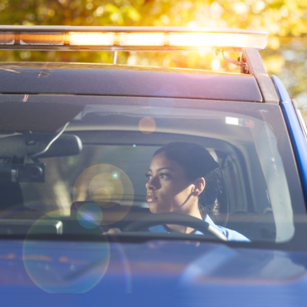 Signal officer in patrol car. 